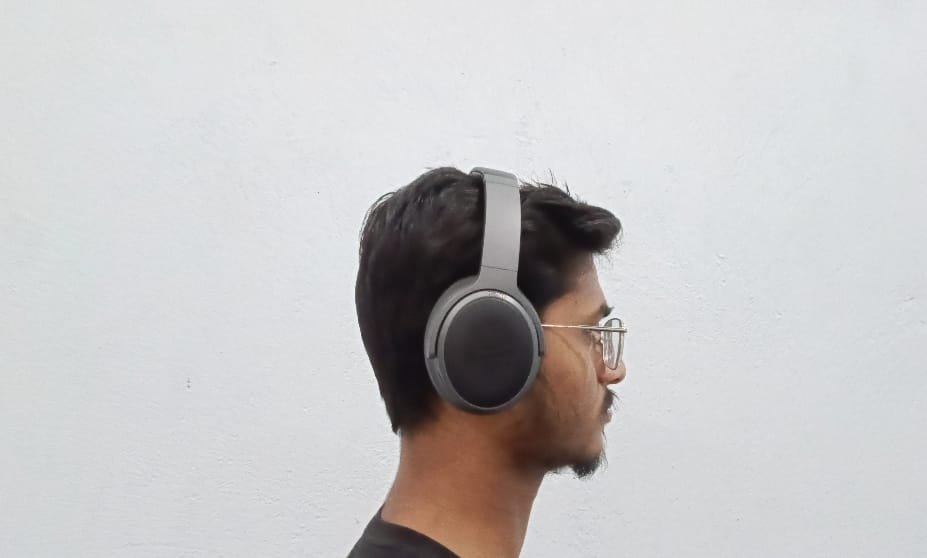 A Teen Age boy have Kiwi Ears ARDOR Headphone on his Ears.